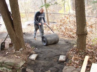 After the RAP (recycled asphalt) was placed, graders were used to smooth the path.