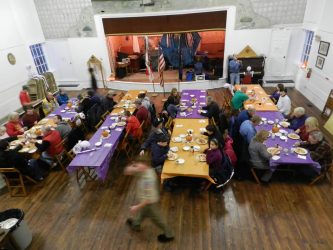 Alan moves quickly during his event to feed his guests, who enjoy a full meal of spaghetti with homemade sauce, side salad, bread roll and brownie dessert.