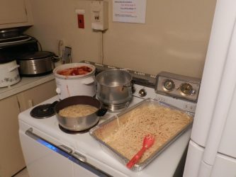 Alan pre-cooked pasta and reheated it to reduce the time required for serving guests. Pasta sauce was created in crackpots with beef and vegetarian options.