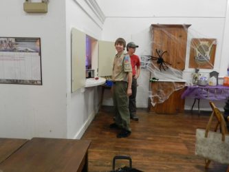 Alan smiles as he organizes the scouts from Troop 21 to serve guests at his spaghetti supper fundraiser.