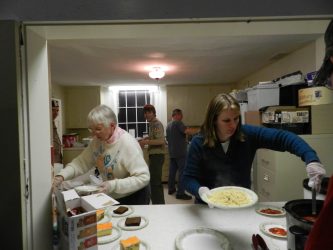 Alan's stepmother and grandmother Janet Foster and Anita Creager assist in making plates for customers.