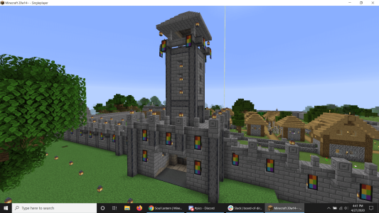 Alan's first Minecraft base, showcasing his flag banner and the wall design and castle keep for entering and leaving the base.